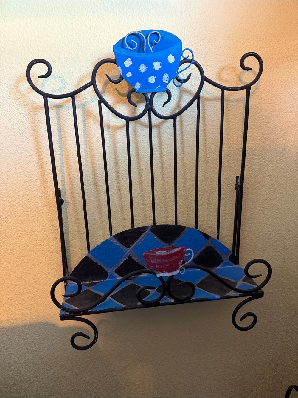 Hand-Painted Blue and Black Metal Wall Shelf with Red Cup Accent
